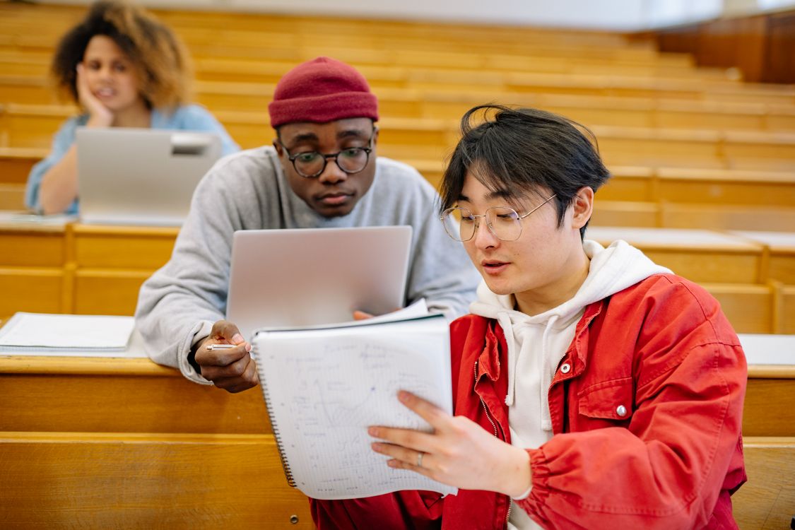 University students studying together in a lecture hall